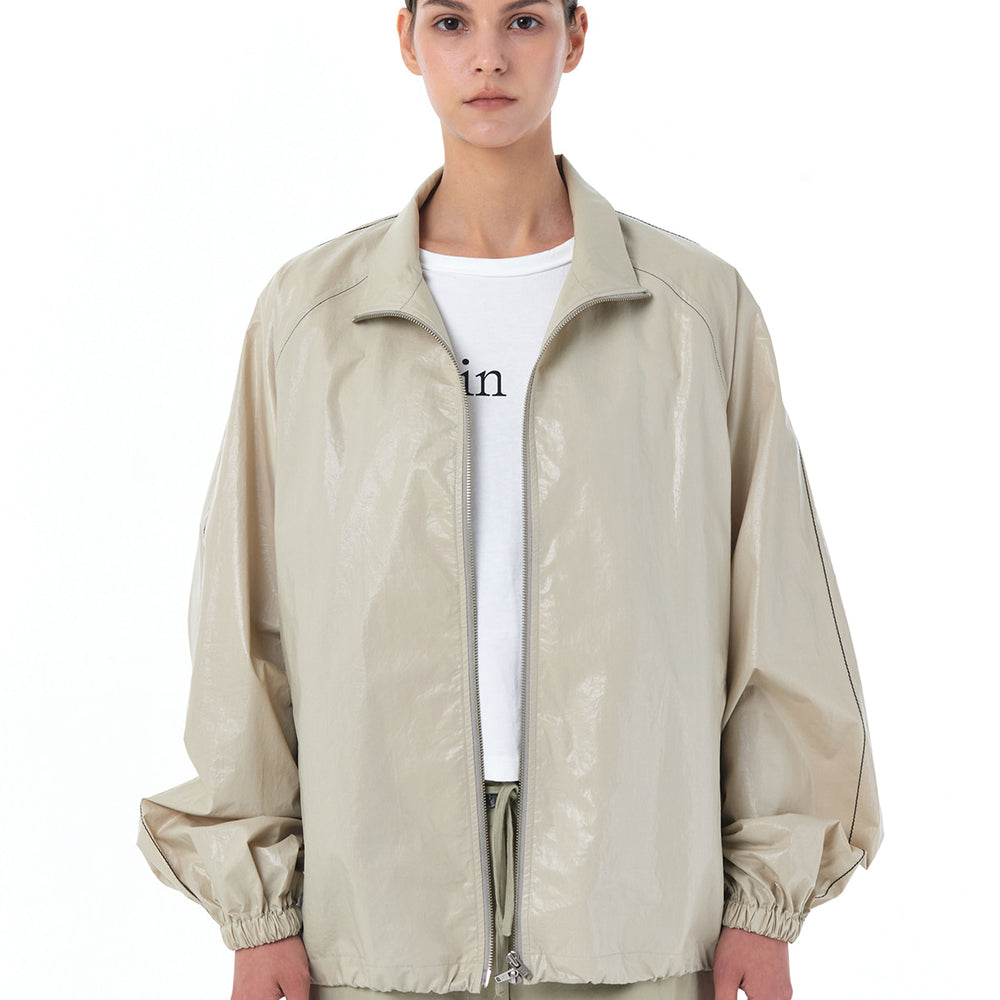 MATIN KIM LOGO COATING JUMPER IN BEIGE