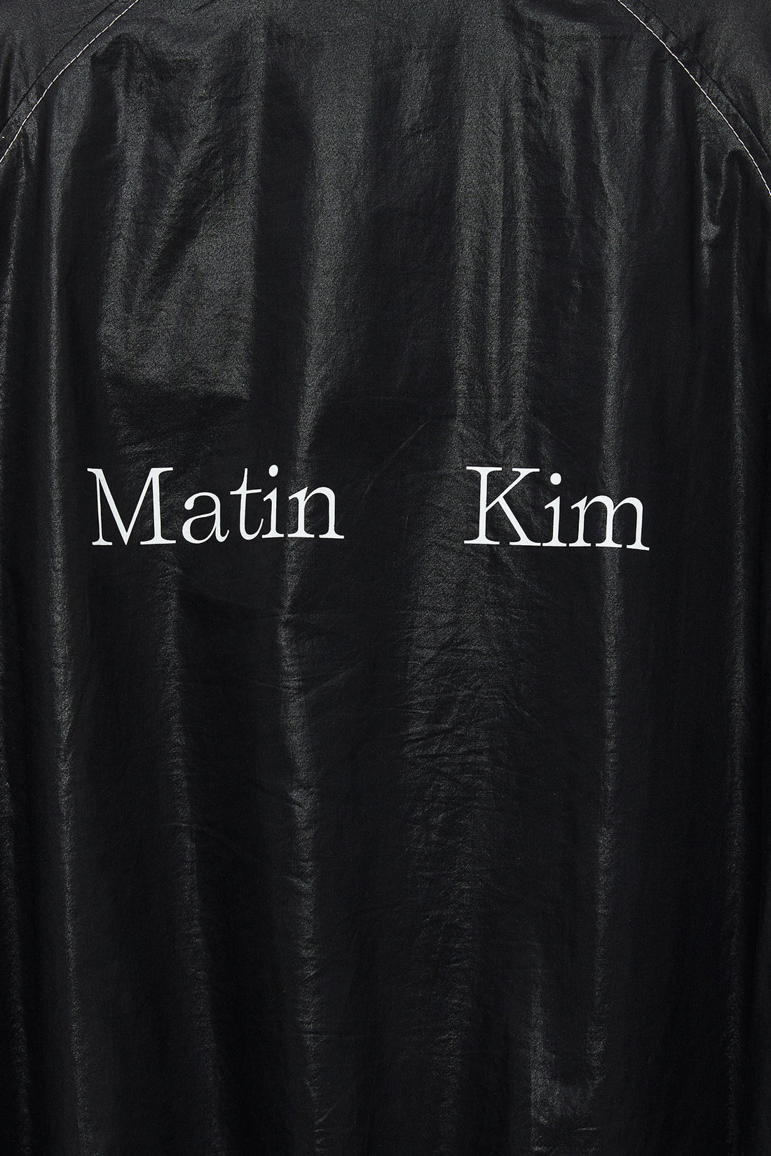 MATIN KIM LOGO COATING JUMPER IN BLACK