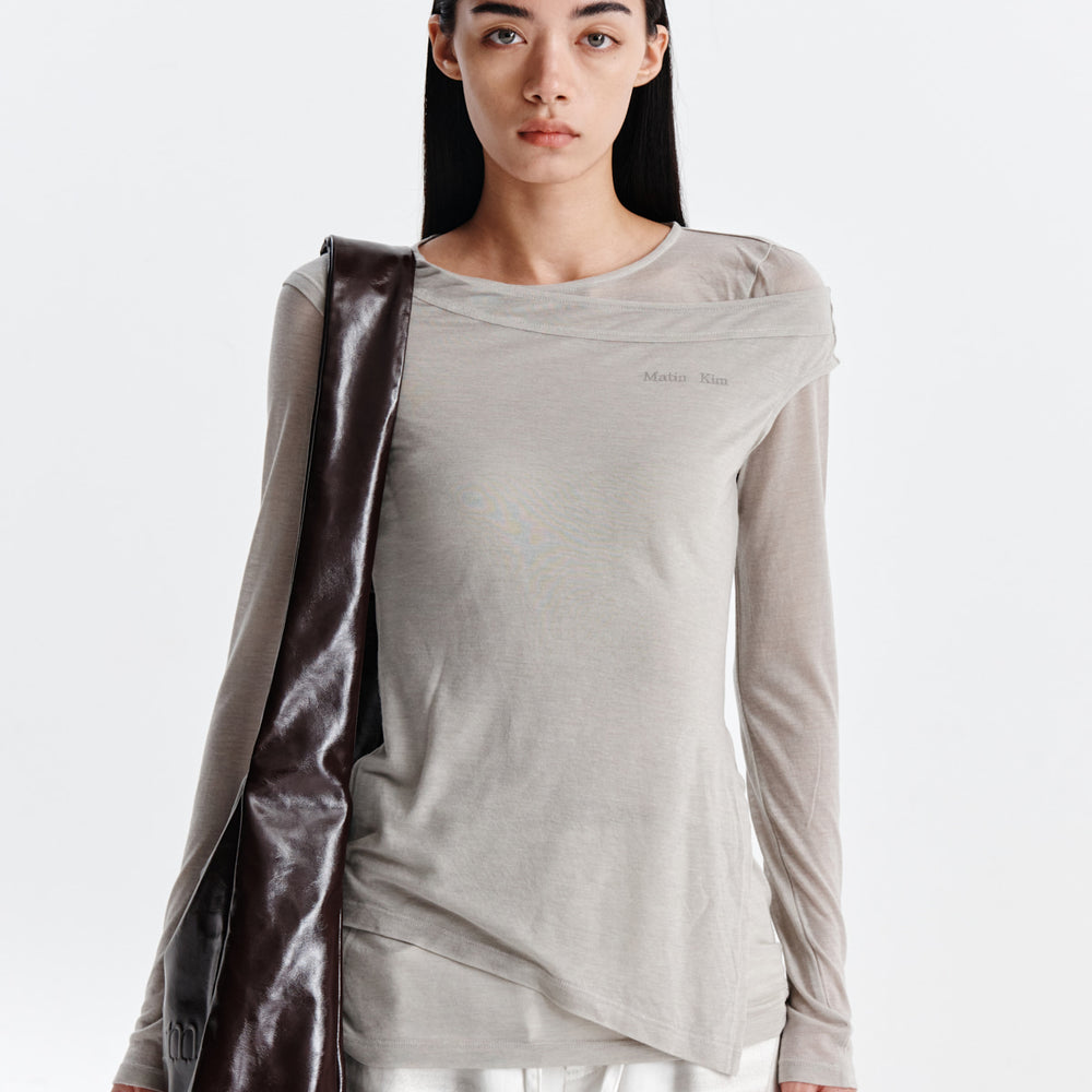 MATIN KIM SLIT POINT SLEEVELESS LAYERED TOP IN BEIGE