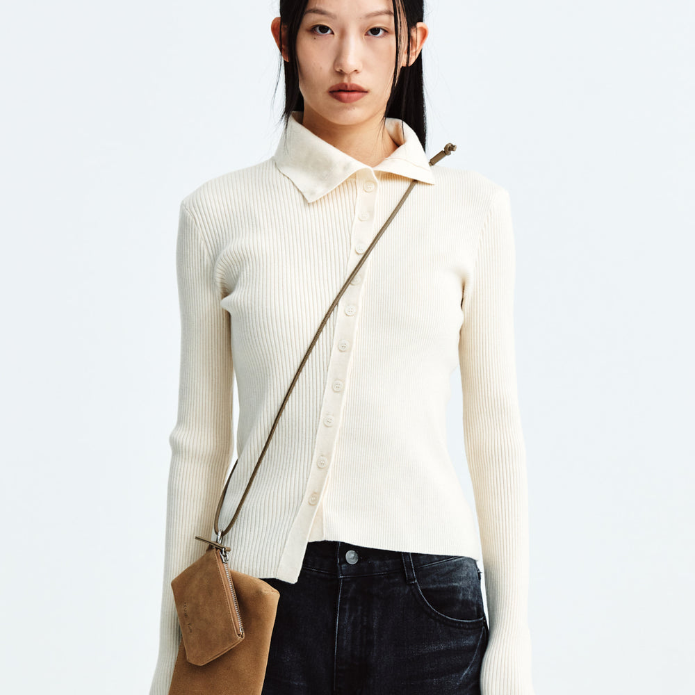 
                  
                    MATIN KIM DIAGONAL BUTTON POINT SLIM CARDIGAN IN IVORY
                  
                