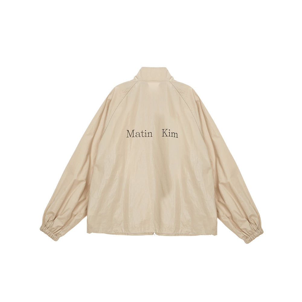 
                  
                    MATIN KIM LOGO COATING JUMPER IN BEIGE
                  
                